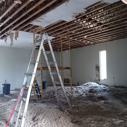 Interior room stripped to ceiling joists during demolition work